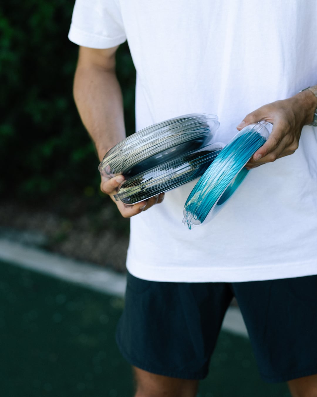 reString Week: a player holding reString string reels
